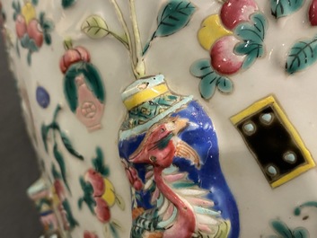 A Chinese relief-moulded famille rose 'antiquities' vase, 19th C.